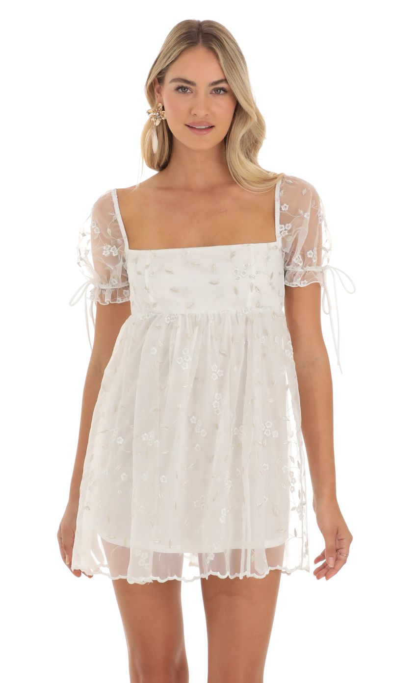 Picture Emerson Embroidered Floral Baby Doll Dress in White. Source: https://media.lucyinthesky.com/data/May23/850xAUTO/59f2bb61-a9c7-4c4b-82df-a11a3787c4ad.jpg