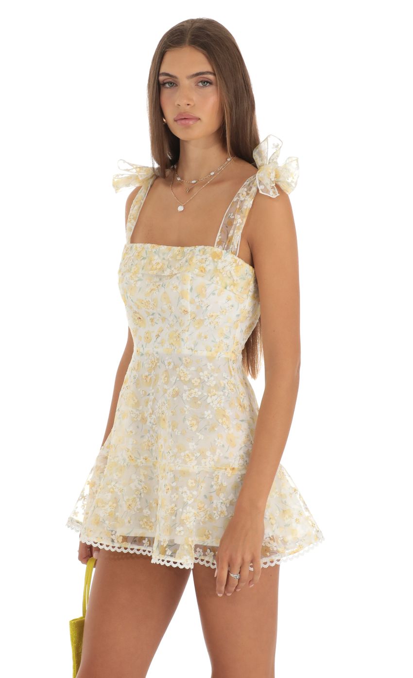 Picture Zev Shimmer Yellow Floral Mini Dress in White. Source: https://media.lucyinthesky.com/data/May23/850xAUTO/65edbbaa-d924-4daa-8a50-74fc5bd19354.jpg