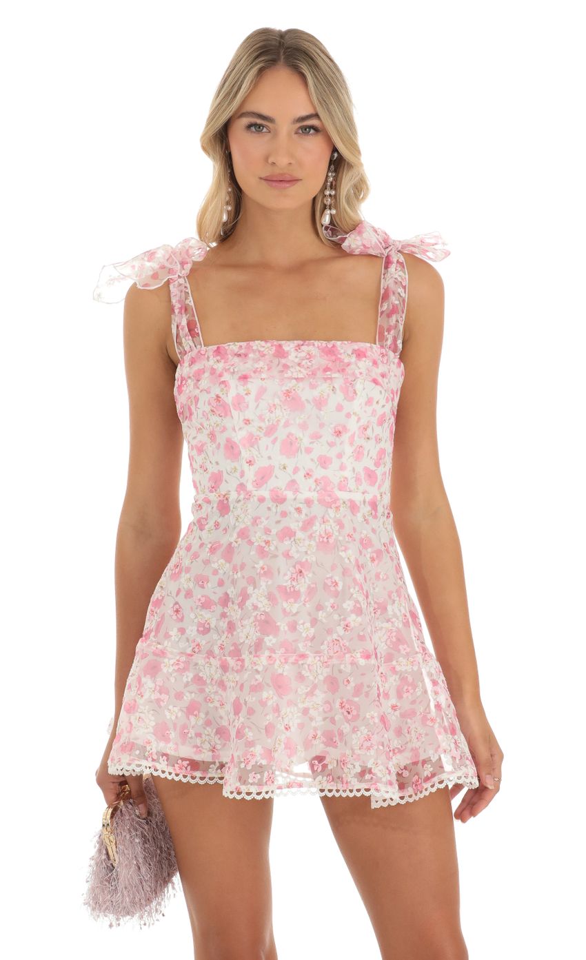 Picture Zev Shimmer Pink Floral Mini Dress in White. Source: https://media.lucyinthesky.com/data/May23/850xAUTO/6852adb3-7fef-4c70-a25b-6553d871db1a.jpg