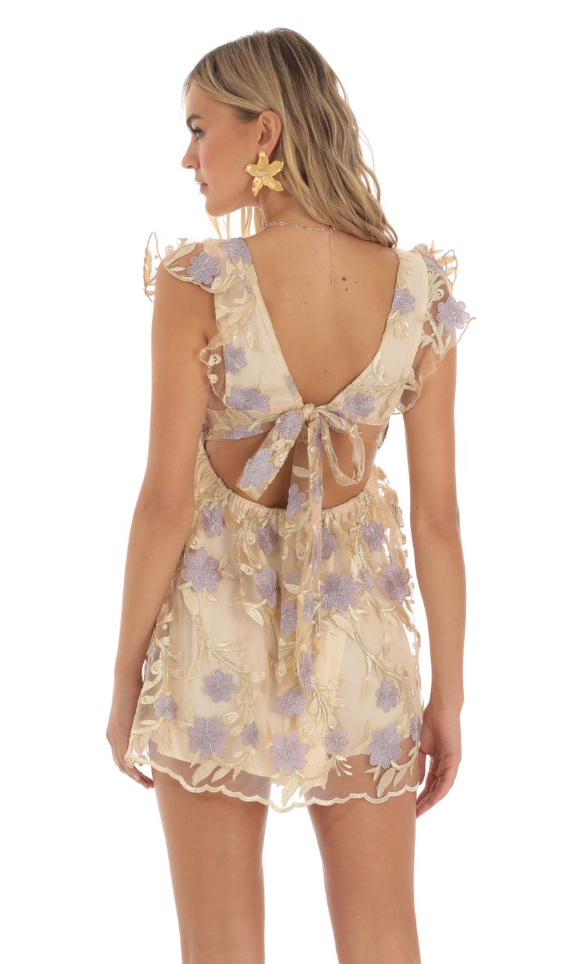 Picture Flor Embroidered Baby Doll Dress in Gold. Source: https://media.lucyinthesky.com/data/May23/850xAUTO/cb5bf1bc-bb9d-4007-8622-a933374392c8.jpg