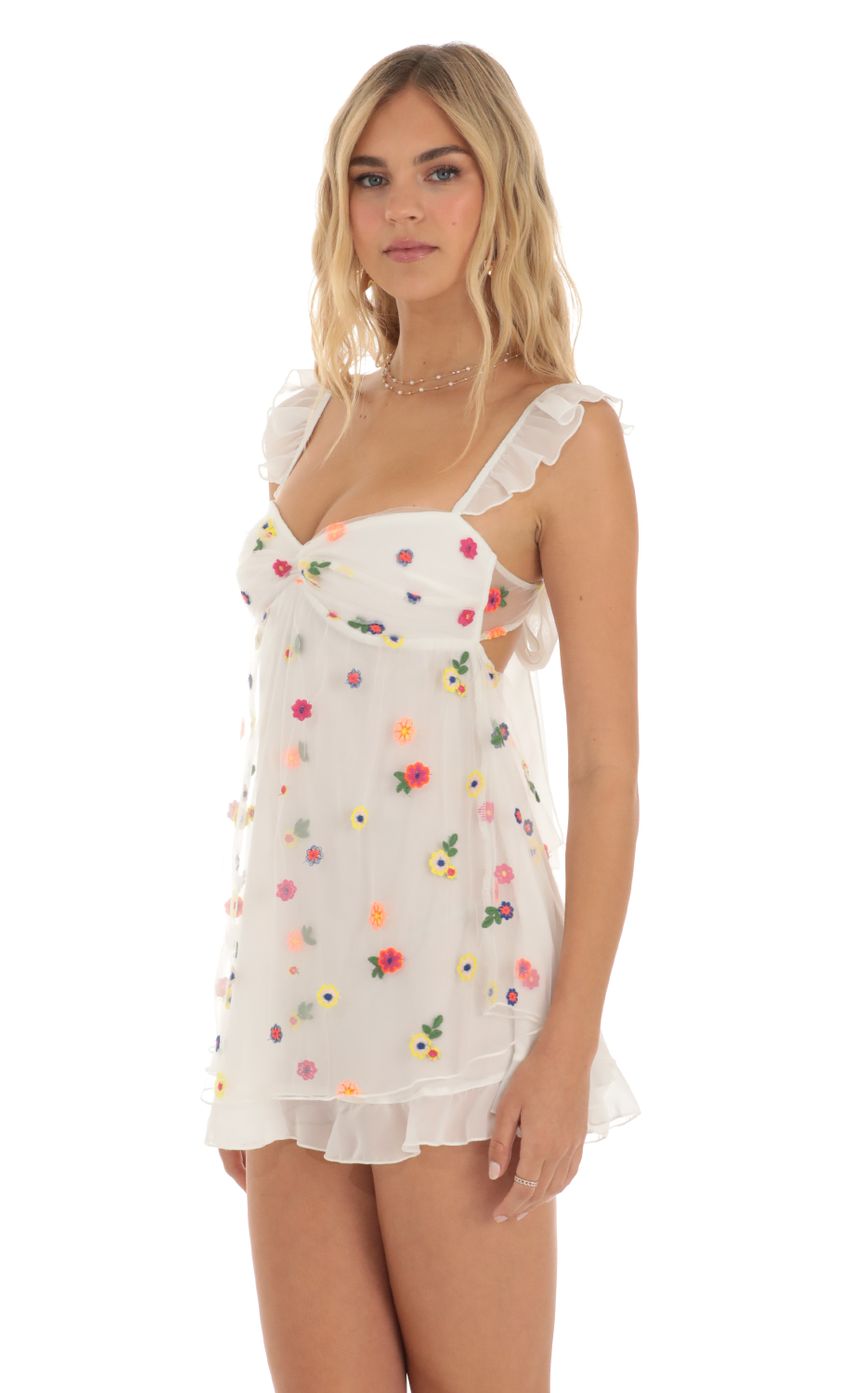 Picture Saanvi Multi Floral Babydoll Dress in White. Source: https://media.lucyinthesky.com/data/May23/850xAUTO/e0250b1d-4bd3-4ecd-a013-6c7b6f80f35a.jpg