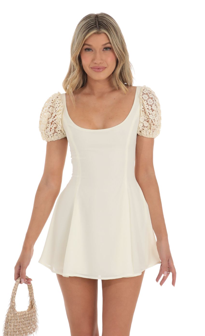 Picture Wannda Puff Sleeve Dress in Cream with Crochet Sleeves. Source: https://media.lucyinthesky.com/data/May23/850xAUTO/f43c29e7-d28c-4b20-a539-7c531a325fc8.jpg