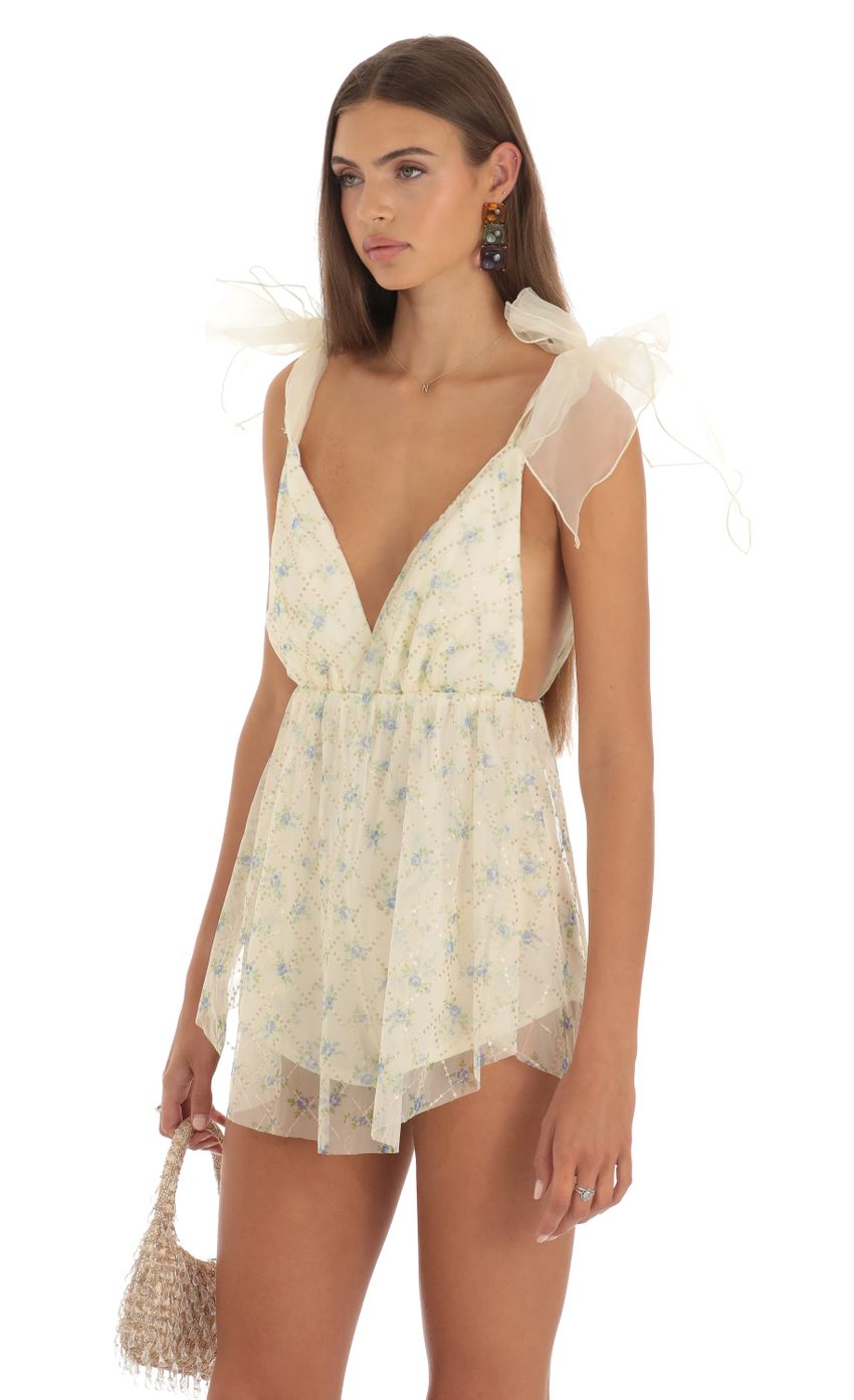 Picture Magdalena Floral Shimmer Sequin Romper in Yellow. Source: https://media.lucyinthesky.com/data/May23/850xAUTO/f94c6de7-e8c2-49e2-ae31-9be4ce3992ec.jpg