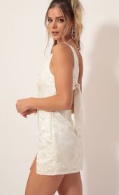 Picture thumb Liana Satin Jacquard Shoulder Dress in Ivory. Source: https://media.lucyinthesky.com/data/Nov19_2/170xAUTO/781A8505.JPG