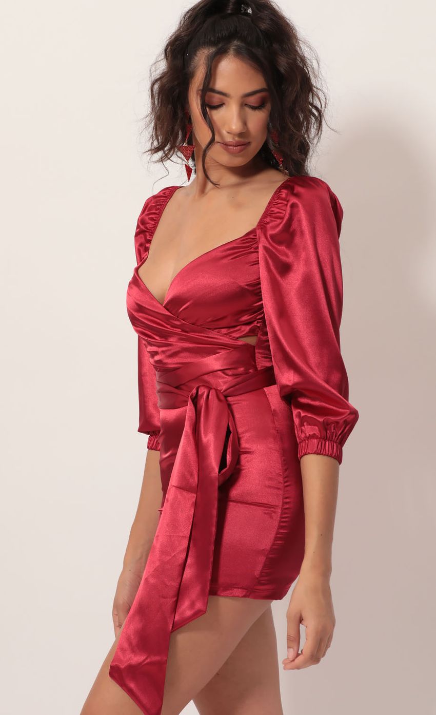 Picture Miley Puff Sleeve Wrap Dress in Red Satin. Source: https://media.lucyinthesky.com/data/Nov19_2/850xAUTO/781A4552.JPG