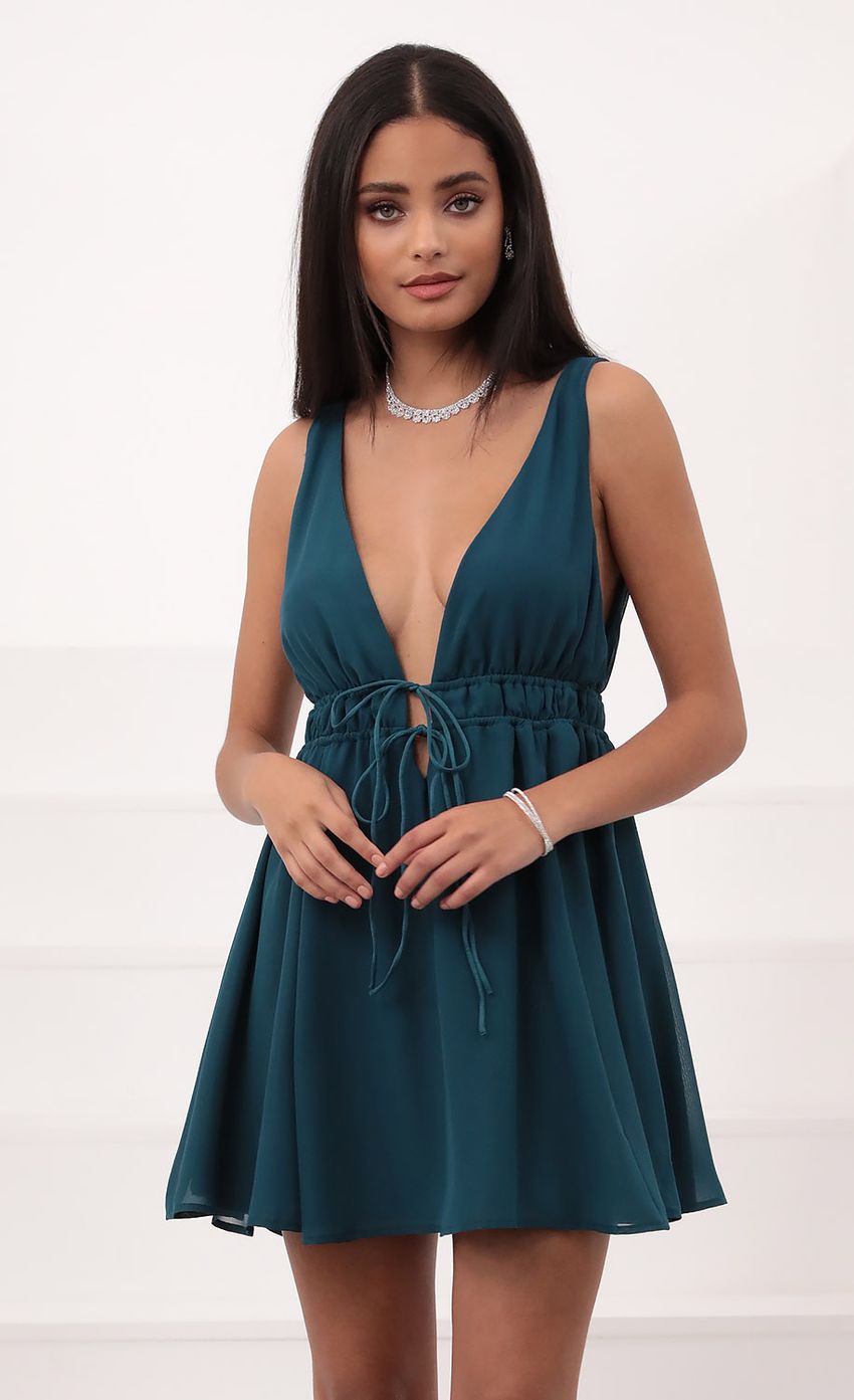 Picture Svana Plunge A-line Dress in Hunter Green. Source: https://media.lucyinthesky.com/data/Nov20_2/850xAUTO/1V9A4906.JPG