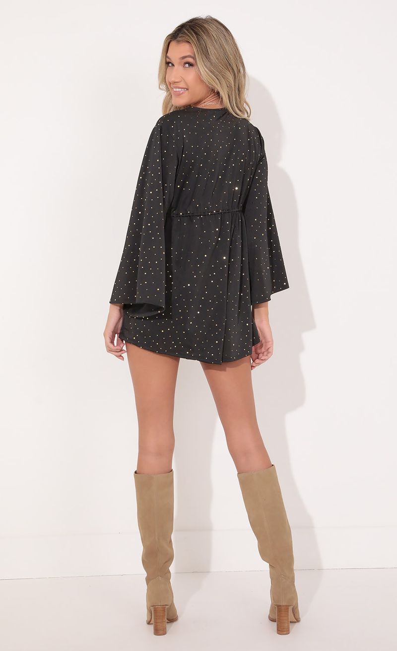 Picture Kadee Bell Sleeve Romper in Twinkling Black. Source: https://media.lucyinthesky.com/data/Nov21_1/800xAUTO/1V9A1045.JPG