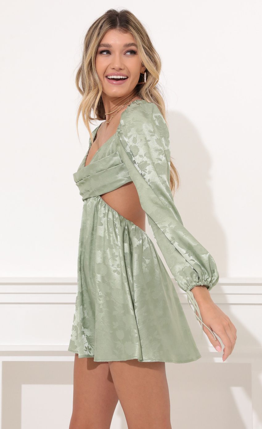 Picture Krista Long Sleeve Fit and Flare Dress in Green Floral Satin. Source: https://media.lucyinthesky.com/data/Nov21_2/850xAUTO/1V9A0089.JPG