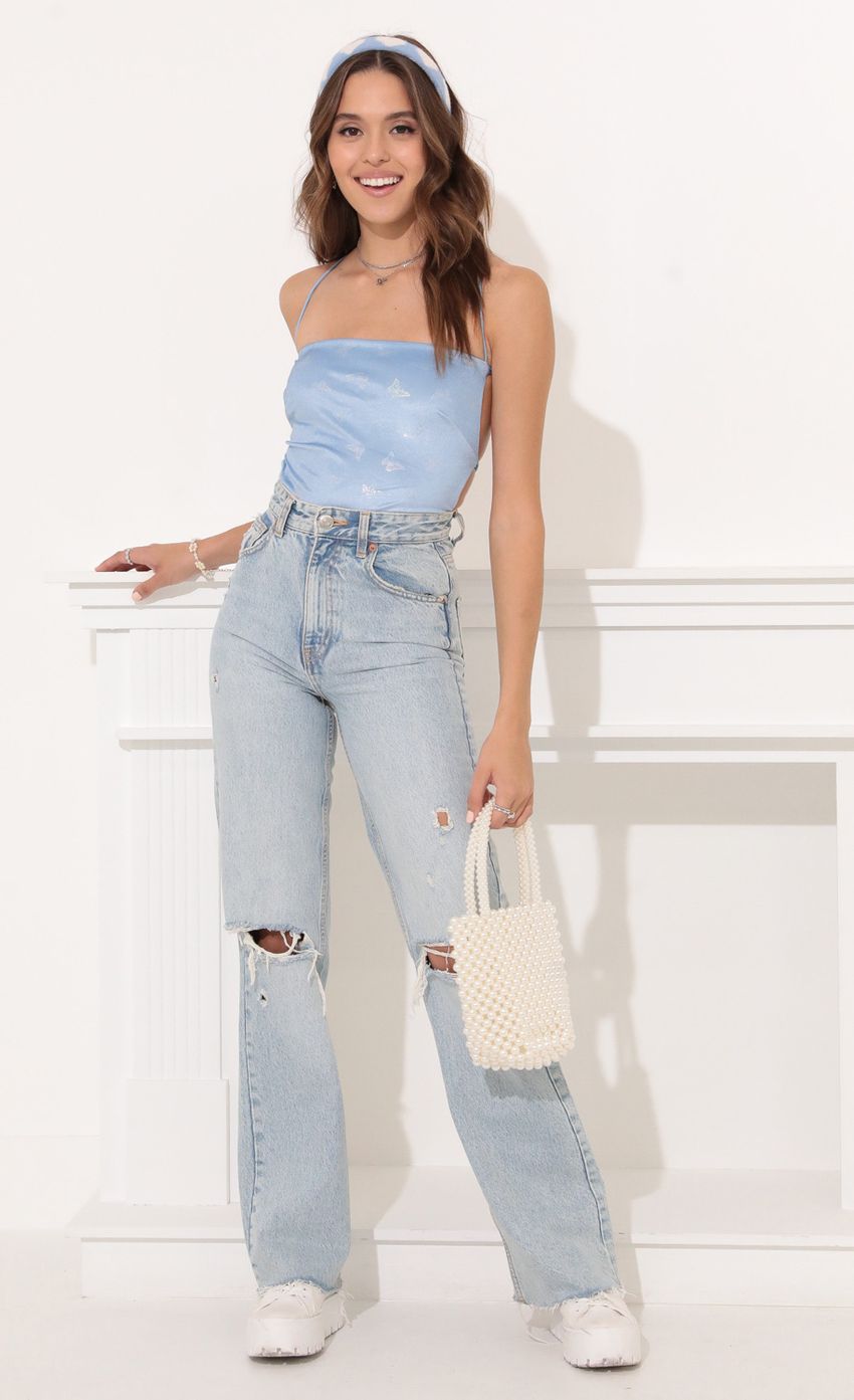 Picture Strappy Back Bodysuit in Blue Velvet Butterfly. Source: https://media.lucyinthesky.com/data/Nov21_2/850xAUTO/1V9A12021.JPG