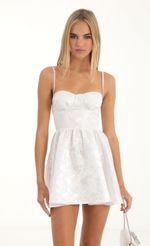 Picture Tabby Floral Jacquard Corset Dress in White. Source: https://media.lucyinthesky.com/data/Nov22/150xAUTO/2d39b403-00e1-437e-b126-ab5324a9e0ab.jpg