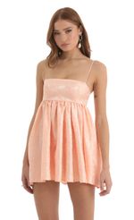 Picture Liora Floral Jacquard Babydoll Dress in Peach. Source: https://media.lucyinthesky.com/data/Nov22/150xAUTO/7c0eed7b-2870-4ce6-80f9-8e300087e3d6.jpg