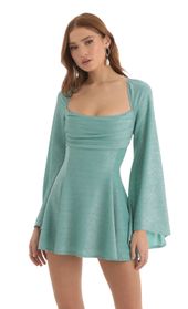 Picture thumb Sirena Metallic Knit Flare Sleeve Dress in Teal. Source: https://media.lucyinthesky.com/data/Nov22/170xAUTO/b1c36fea-dde6-499f-acaf-d9c5a37908ab.jpg