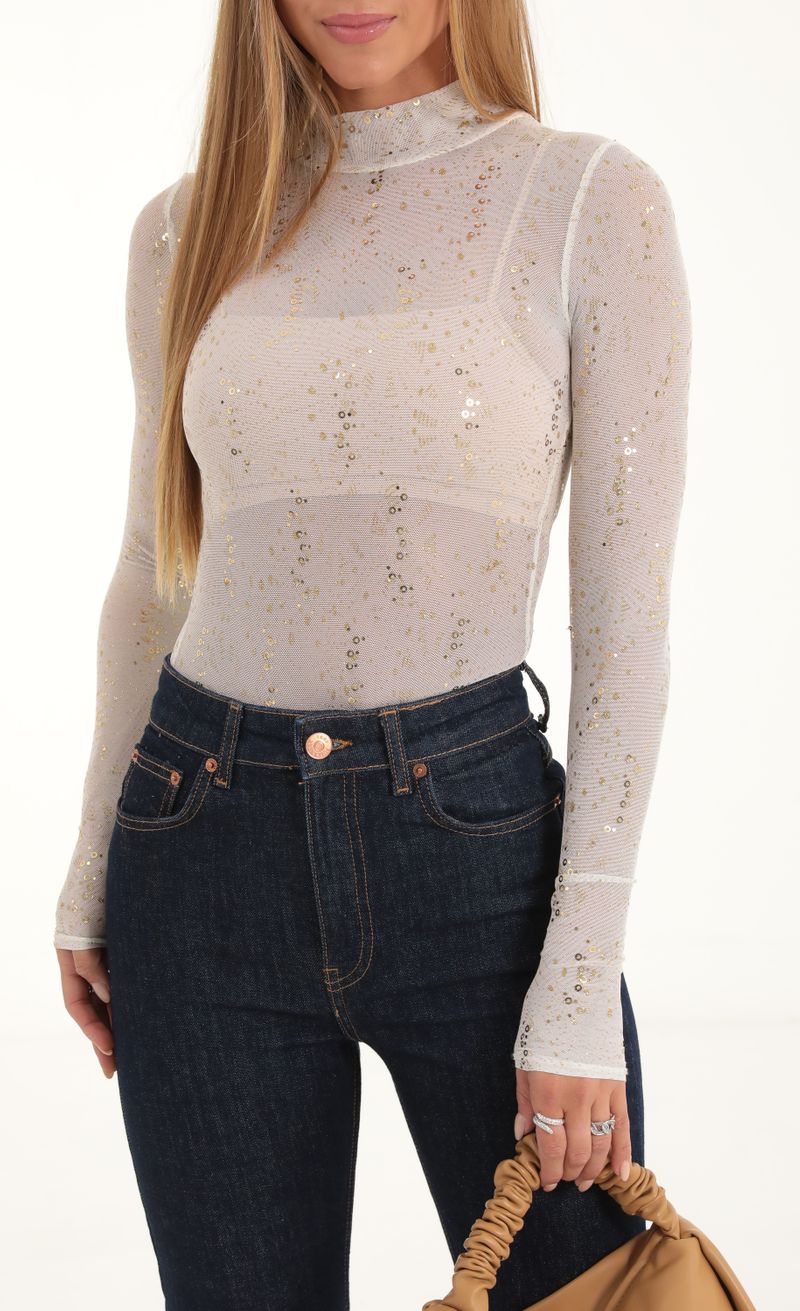 Picture Aubriella Mesh Glitter Sequin Long Sleeve Bodysuit in White. Source: https://media.lucyinthesky.com/data/Nov22/800xAUTO/a0922425-256c-49c9-92b2-246b6219a444.jpg