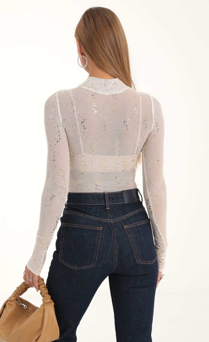 Picture Aubriella Mesh Glitter Sequin Long Sleeve Bodysuit in White. Source: https://media.lucyinthesky.com/data/Nov22/800xAUTO/d3b73197-f77d-428f-bbbf-02a9433f8702.jpg