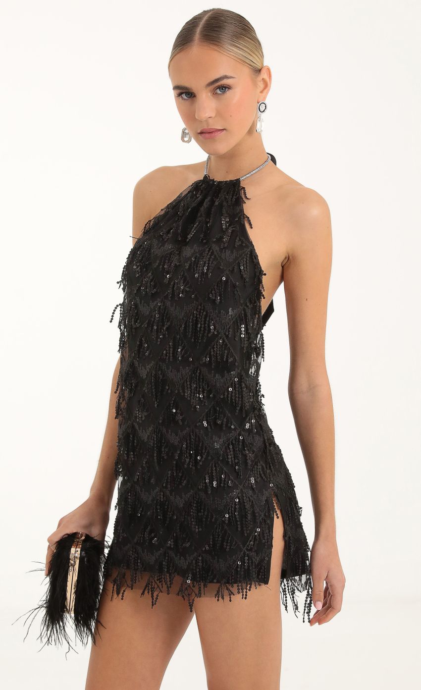 Picture Vesper Fringe Sequin Halter Dress in Black. Source: https://media.lucyinthesky.com/data/Nov22/850xAUTO/6d110072-ff24-4ff8-bd3a-e7002b01d5de.jpg