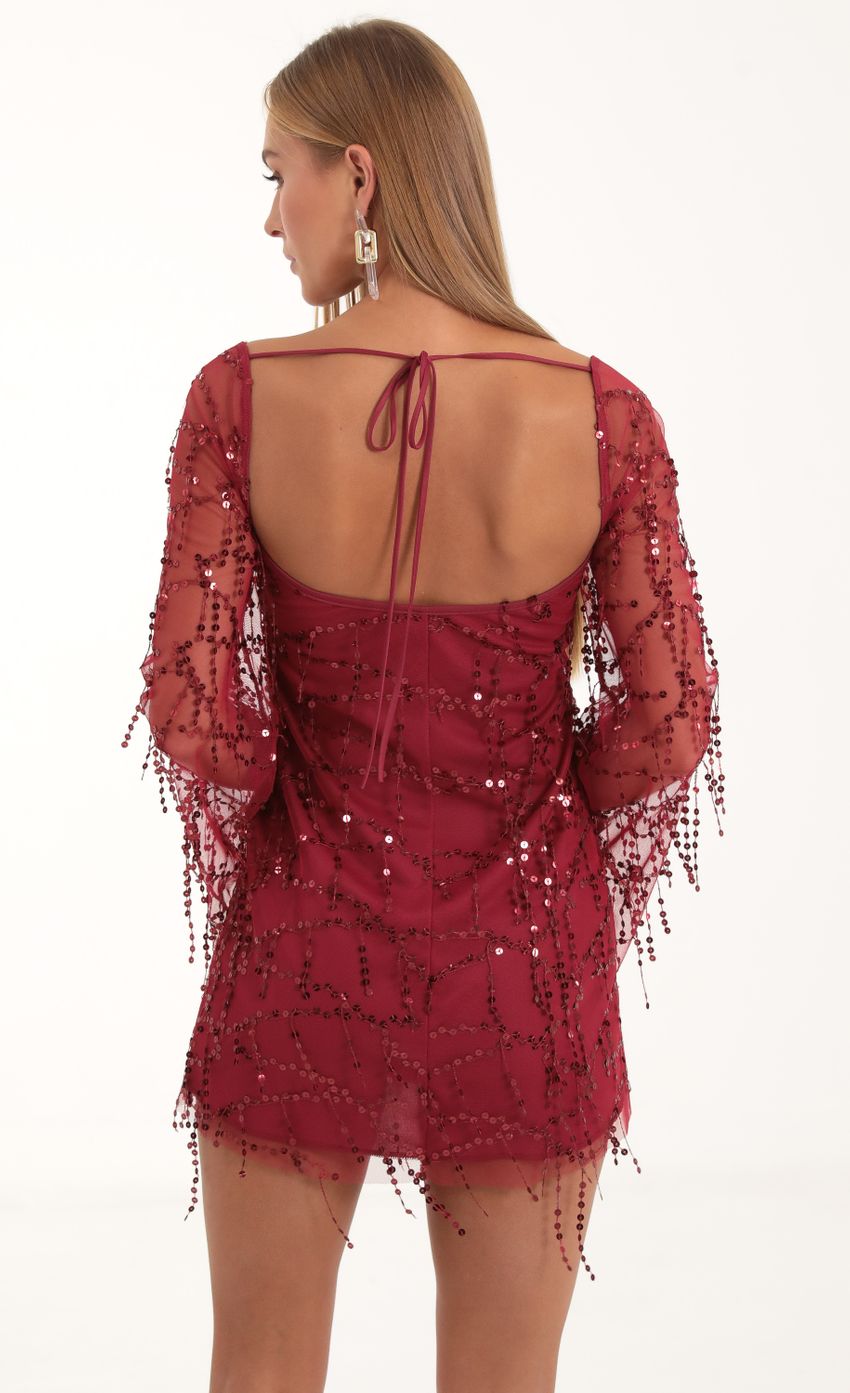 Picture Wynnie Fringe Sequin Flare Sleeve Dress in Red. Source: https://media.lucyinthesky.com/data/Nov22/850xAUTO/70143967-c412-4c5b-8131-a6b422473d34.jpg