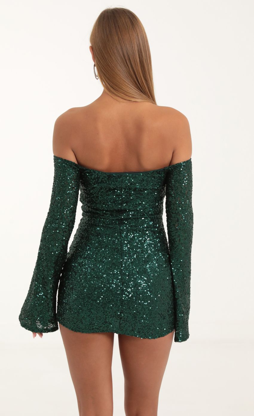 Picture Della Sequin Long Sleeve Bodycon Dress in Green. Source: https://media.lucyinthesky.com/data/Nov22/850xAUTO/9d9ba35f-b5a4-475a-93ae-c535bc8cf8eb.jpg