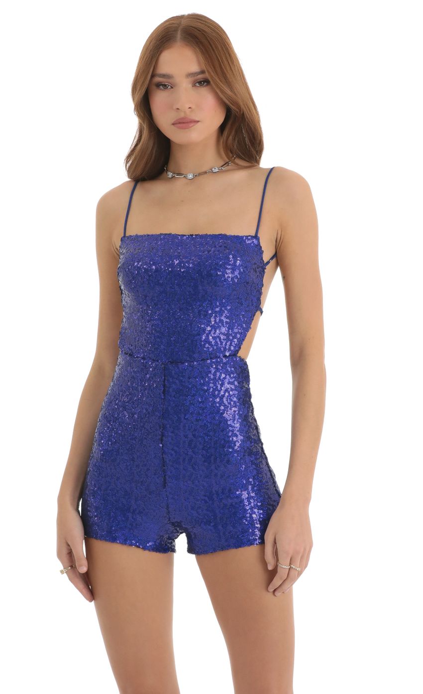 Picture Legacy Sequin Open Back Romper in Blue. Source: https://media.lucyinthesky.com/data/Nov22/850xAUTO/d4d980b2-9b1d-41cc-aac3-7b9e9aeb4556.jpg