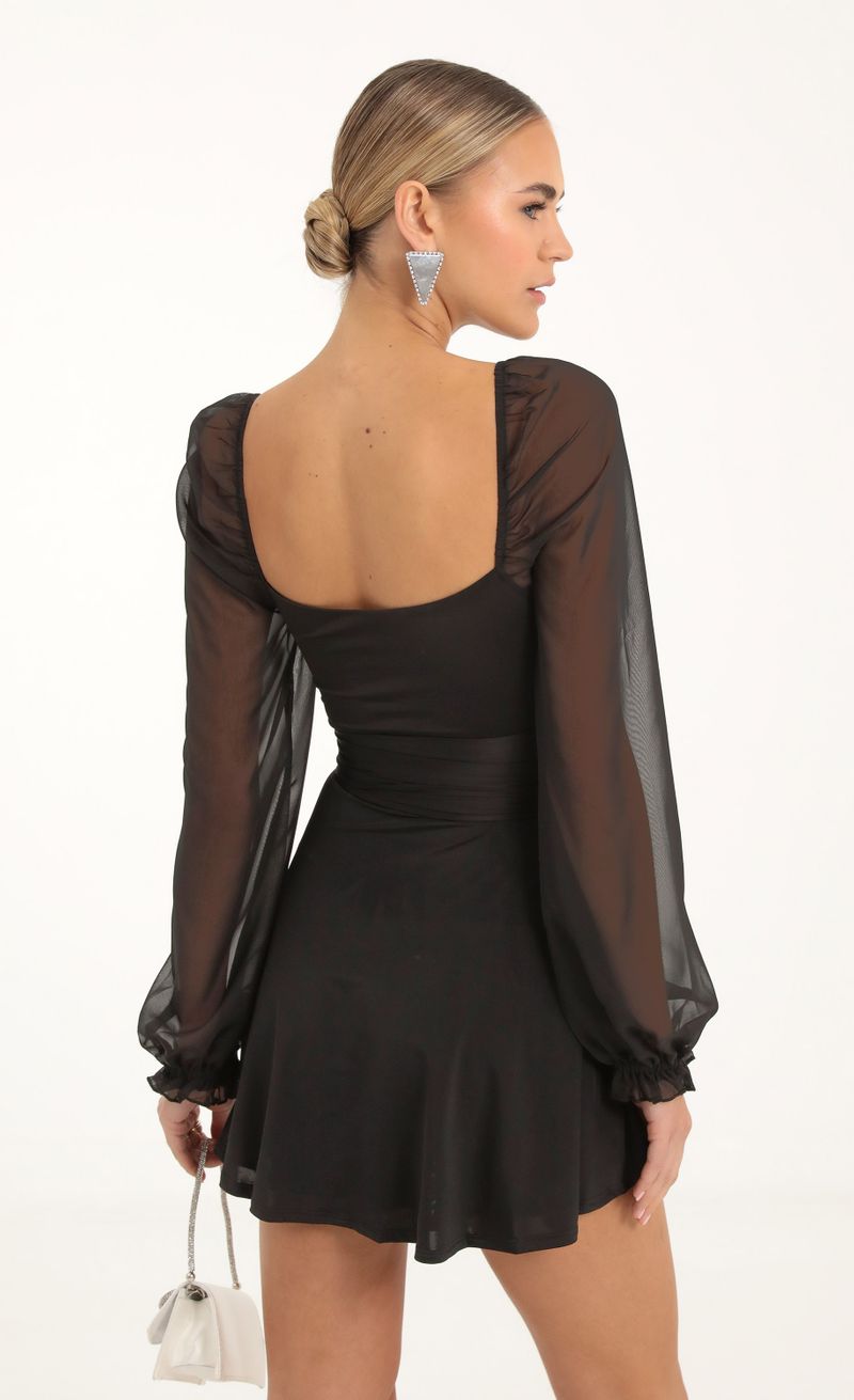 Picture Aliah Puff Chiffon Wrap Dress in Black. Source: https://media.lucyinthesky.com/data/Nov22_1/800xAUTO/1V9A2425.JPG