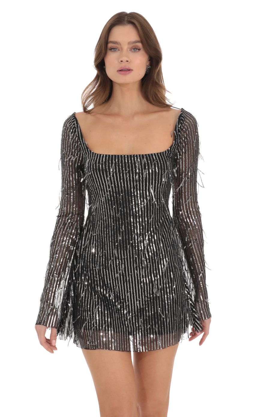 Picture Fringe Silver Sequin Dress in Black. Source: https://media.lucyinthesky.com/data/Nov23/850xAUTO/348f15dc-e9c9-48cb-b7b3-4f20ac02bf11.jpg