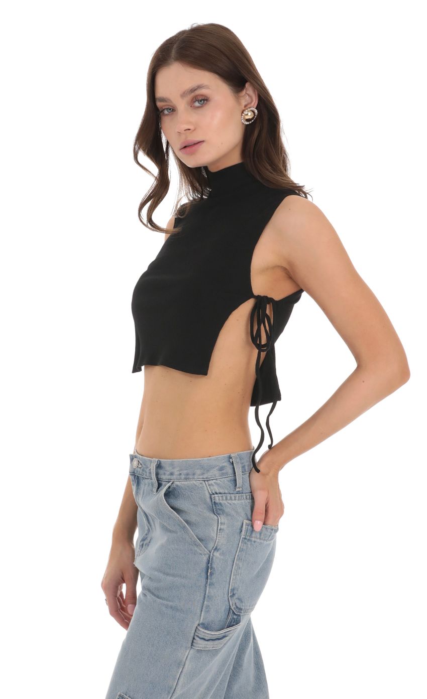 Picture Ribbed Mock Neck Top in Black. Source: https://media.lucyinthesky.com/data/Nov23/850xAUTO/7243670e-a2fb-40cc-8050-0438d84b5e7a.jpg