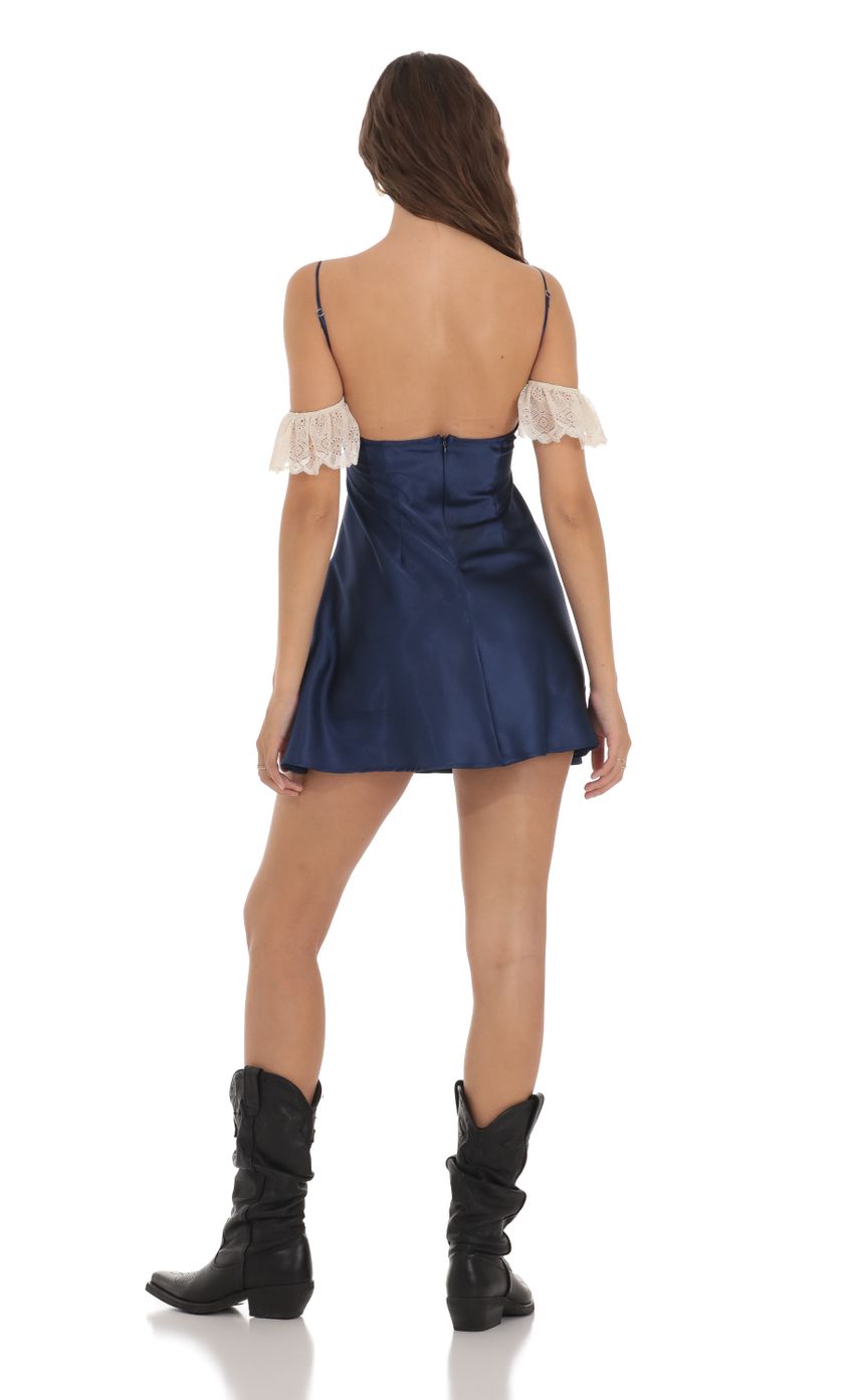 Picture Off Shoulder Lace Satin Dress in Navy. Source: https://media.lucyinthesky.com/data/Nov23/850xAUTO/aba6e179-5855-48c1-9f54-325280d58e0a.jpg