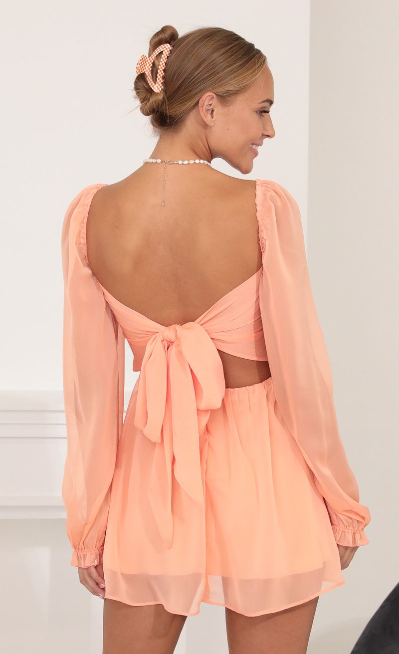 Picture Kaz Fit and Flare Dress in Peach. Source: https://media.lucyinthesky.com/data/Oct21_1/800xAUTO/1V9A2907.JPG