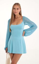 Picture Mehi Glitter Mesh Puff Sleeve Dress in Blue. Source: https://media.lucyinthesky.com/data/Oct22/150xAUTO/14f6599f-05ce-43de-b8b1-aa98e09f8244.jpg