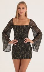 Picture Korra Mesh Sequin Flare Sleeve Dress in Black. Source: https://media.lucyinthesky.com/data/Oct22/150xAUTO/79b45d40-25d6-4055-b9f8-669118f4f370.jpg
