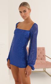 Picture thumb Kirsten Sequin Open Back Long Sleeve Dress in Blue. Source: https://media.lucyinthesky.com/data/Oct22/170xAUTO/0bfb8b78-80c2-4b8d-83ca-ff1863ce64f6.jpg
