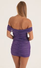 Picture thumb Aza Glitter Mesh Off The Shoulder Dress in Purple. Source: https://media.lucyinthesky.com/data/Oct22/170xAUTO/1a593321-ccad-4799-a0b8-d883649b4607.jpg