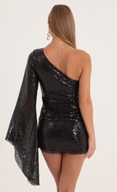 Picture thumb Alisson Sequin Flare Sleeve Dress in Black. Source: https://media.lucyinthesky.com/data/Oct22/170xAUTO/4bf99001-d46d-4eb9-9137-b995b6f0fcf7.jpg