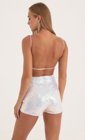 Picture thumb Legacy Iridescent Sequin Open Back Romper in White. Source: https://media.lucyinthesky.com/data/Oct22/170xAUTO/60daa7da-36e2-453f-9a2f-bf52d5f9e4fa.jpg