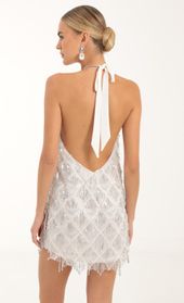 Picture thumb Vesper Fringe Sequin Halter Dress in White. Source: https://media.lucyinthesky.com/data/Oct22/170xAUTO/dec64baa-0786-43c8-9c52-af84be098368.jpg