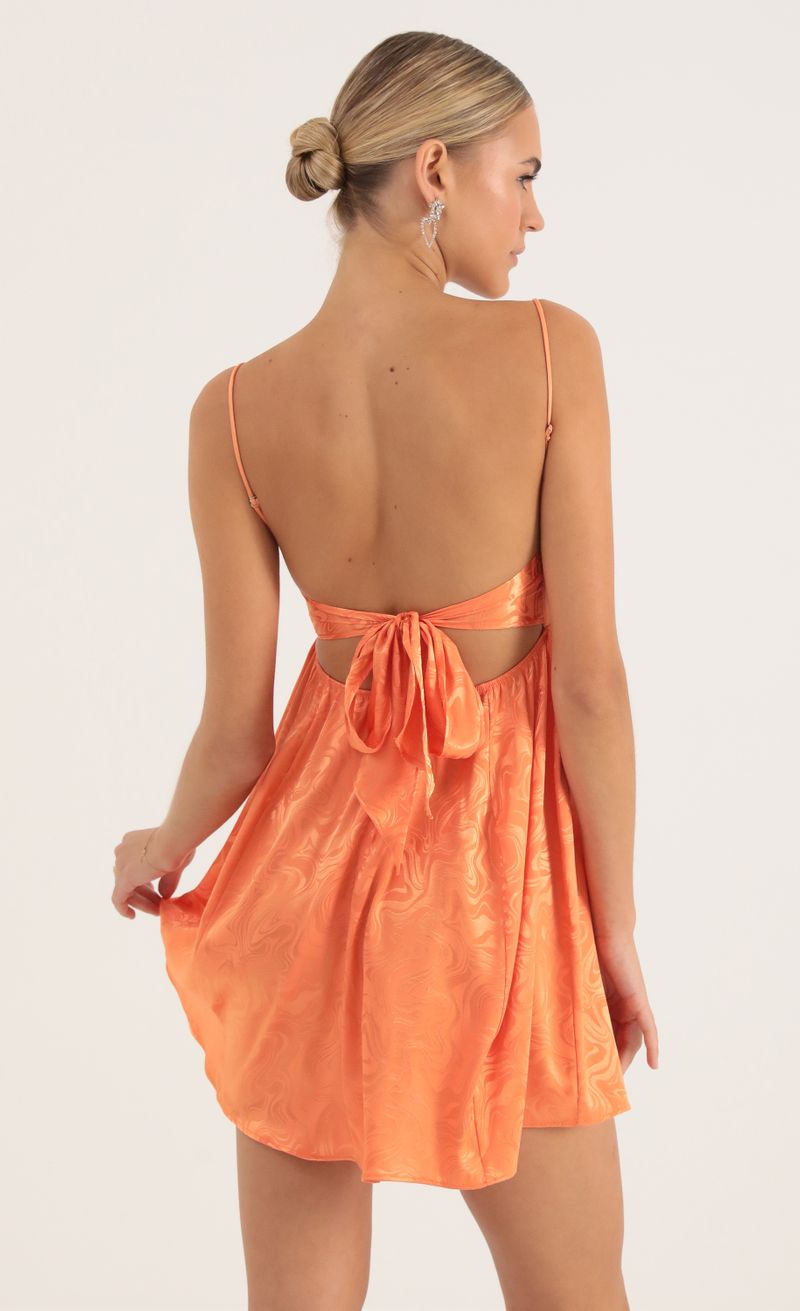 Picture Juno Satin Marble Baby Doll Dress in Orange. Source: https://media.lucyinthesky.com/data/Oct22/800xAUTO/171fbe5c-abc8-485e-a5d7-83d6b3b86dc1.jpg