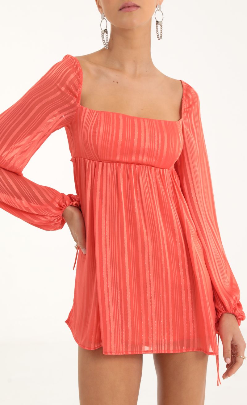 Picture Shayla Striped Long Sleeve Baby Doll Dress in Coral. Source: https://media.lucyinthesky.com/data/Oct22/800xAUTO/20c211c8-4fbe-4a08-a6a8-e99af9bf8246.jpg