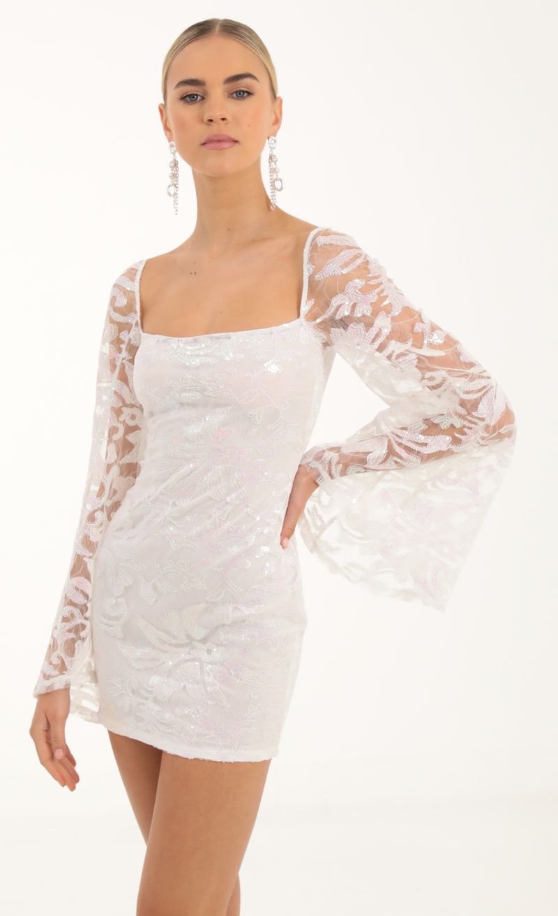 Picture Elly Tulle Iridescent Sequin Flare Sleeve Dress in White. Source: https://media.lucyinthesky.com/data/Oct22/800xAUTO/62ece87a-4807-4c47-a9e9-4f9069ee0209.jpg