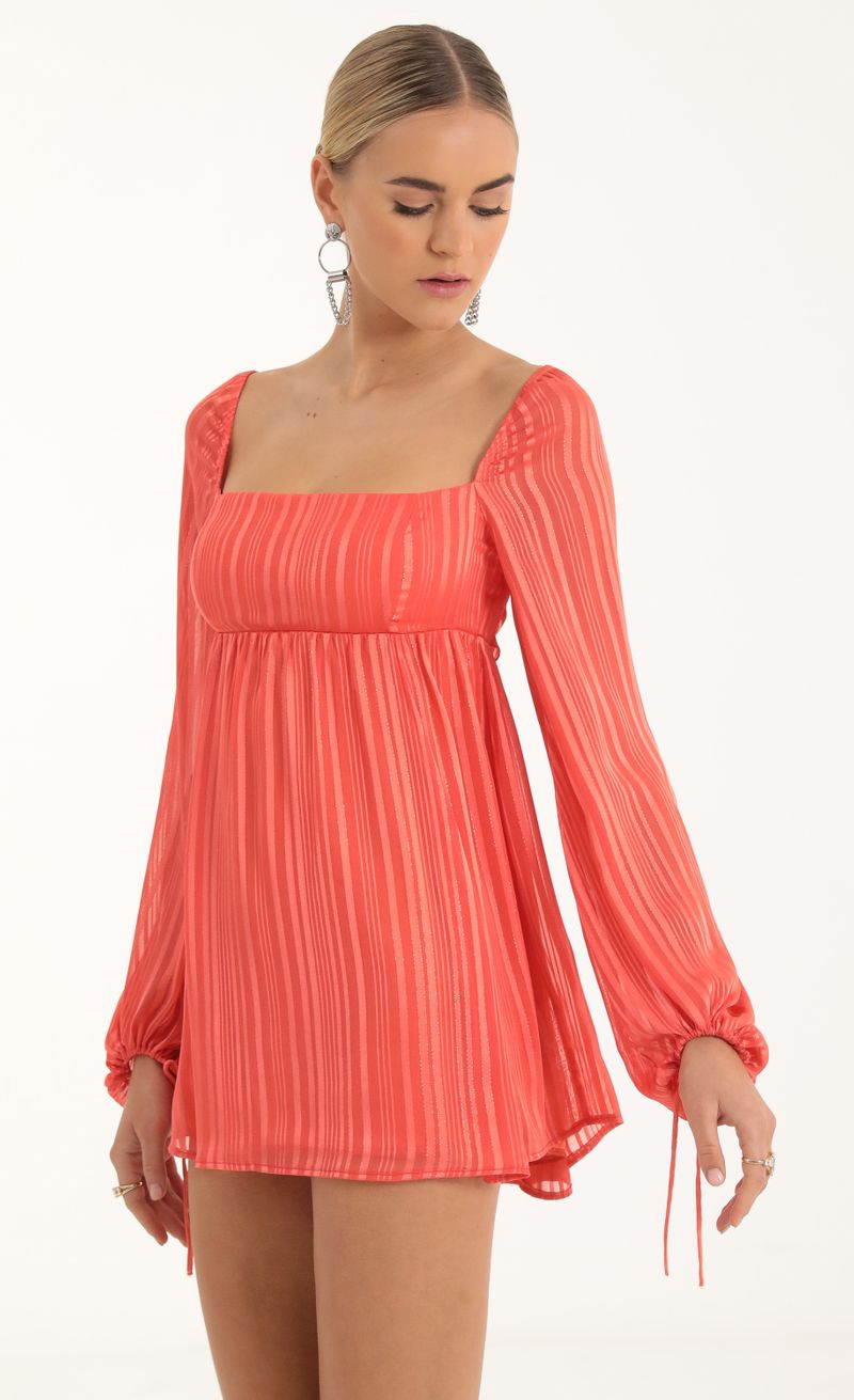 Picture Shayla Striped Long Sleeve Baby Doll Dress in Coral. Source: https://media.lucyinthesky.com/data/Oct22/800xAUTO/90dbc170-da6c-4bfe-8690-01a416e550dd.jpg