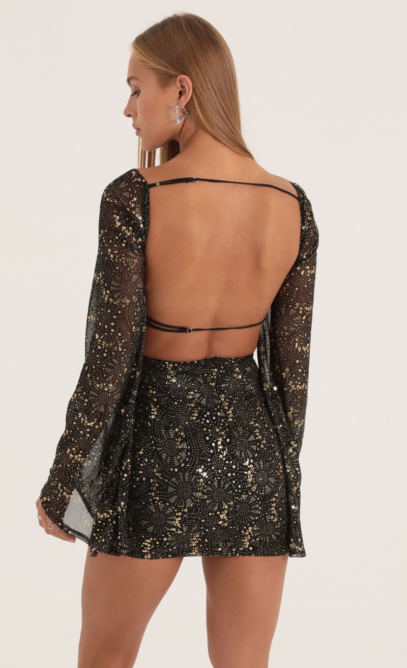 Picture Korra Mesh Sequin Flare Sleeve Dress in Black. Source: https://media.lucyinthesky.com/data/Oct22/800xAUTO/9f908302-d428-45bf-b884-35e7c02d32ca.jpg
