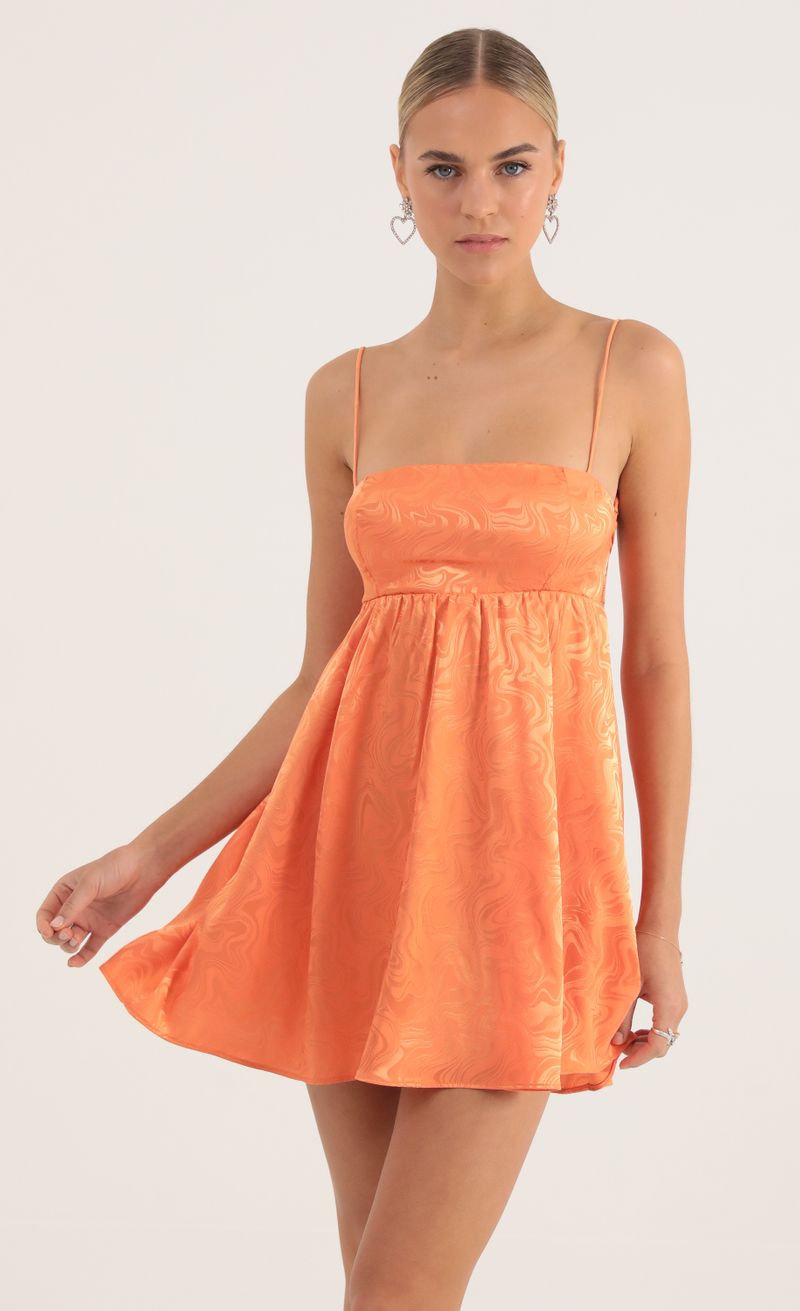 Picture Juno Satin Marble Baby Doll Dress in Orange. Source: https://media.lucyinthesky.com/data/Oct22/800xAUTO/c43a78f5-7c2c-477a-8b49-24d1723a7622.jpg