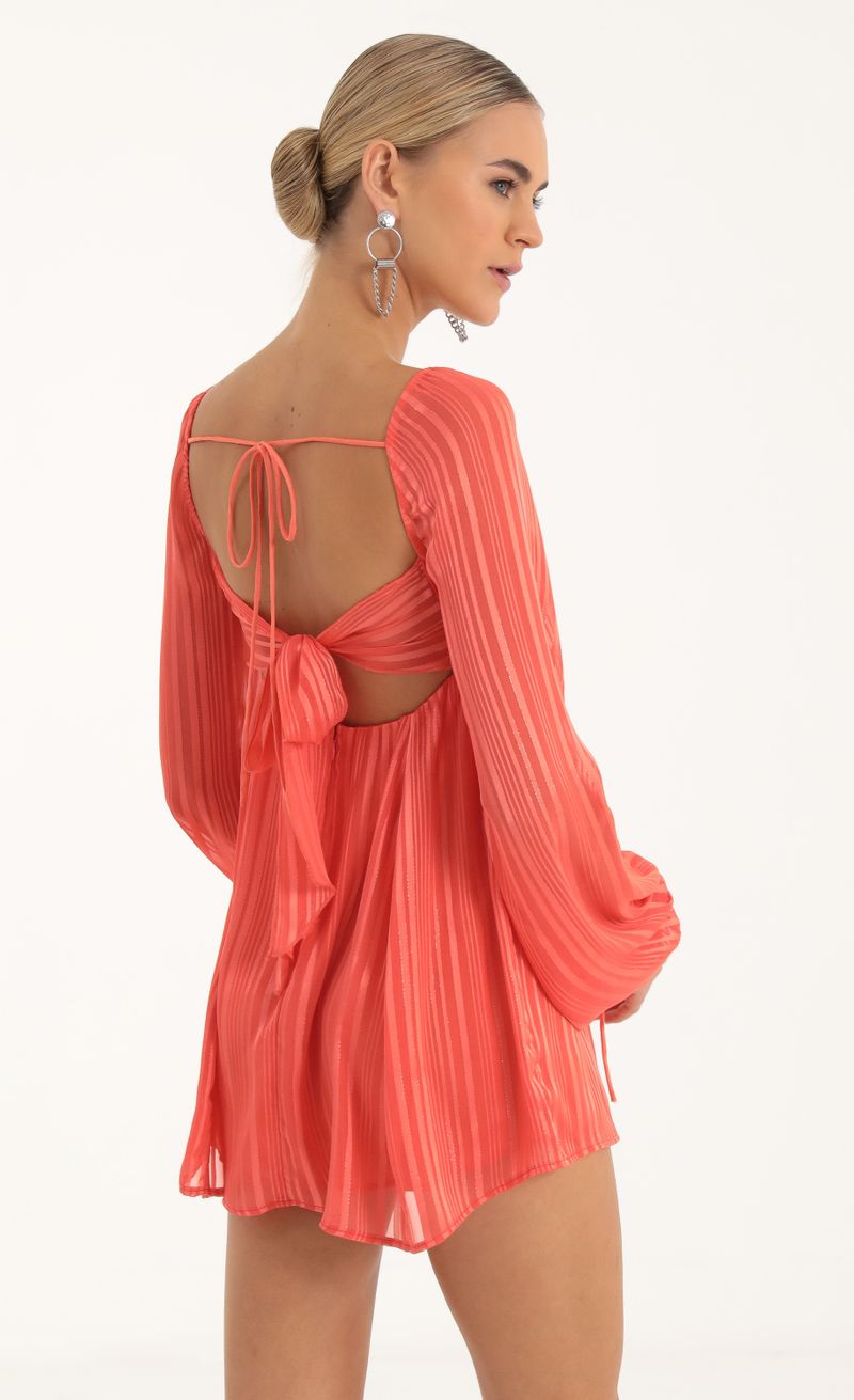 Picture Shayla Striped Long Sleeve Baby Doll Dress in Coral. Source: https://media.lucyinthesky.com/data/Oct22/800xAUTO/d1c15e09-4dfd-4d64-ba6a-e152c880b2ee.jpg