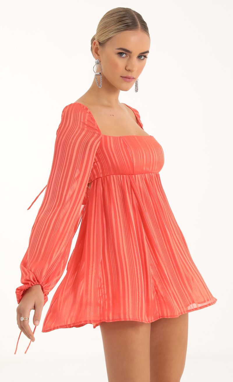 Picture Shayla Striped Long Sleeve Baby Doll Dress in Coral. Source: https://media.lucyinthesky.com/data/Oct22/800xAUTO/ddbe1420-57bf-4306-8452-4e39acfcbcfe.jpg