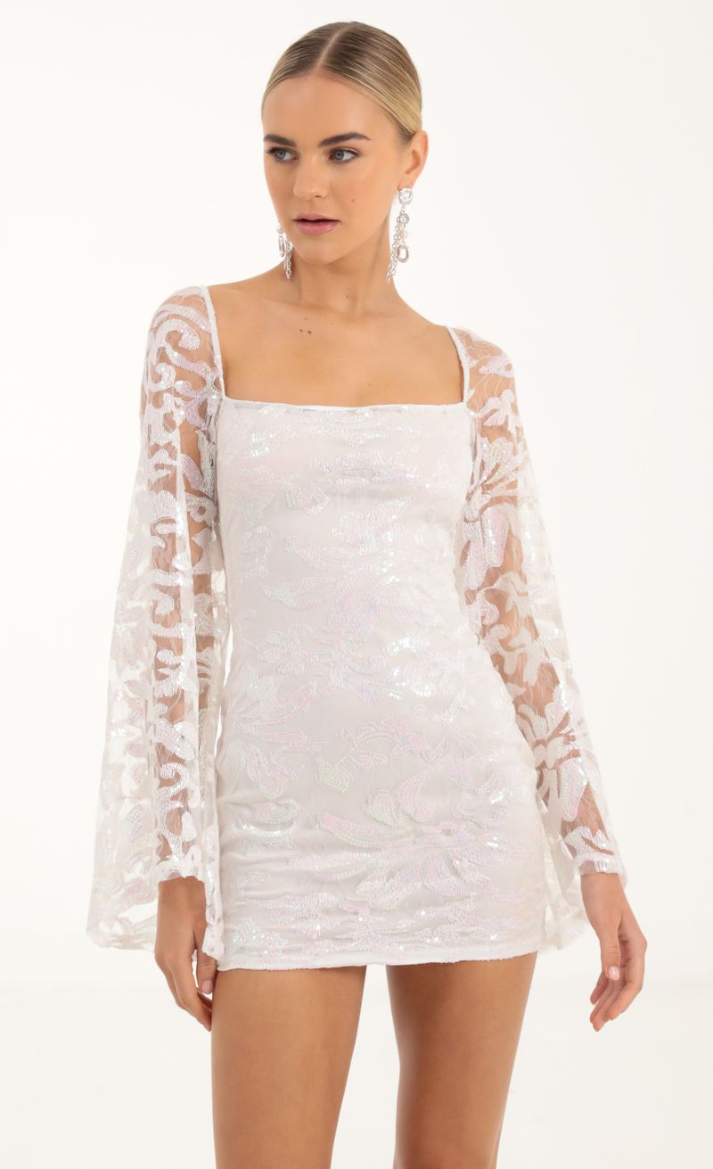 Picture Elly Tulle Iridescent Sequin Flare Sleeve Dress in White. Source: https://media.lucyinthesky.com/data/Oct22/800xAUTO/f0a89b09-d096-4f90-a47b-c58b5c5d0330.jpg
