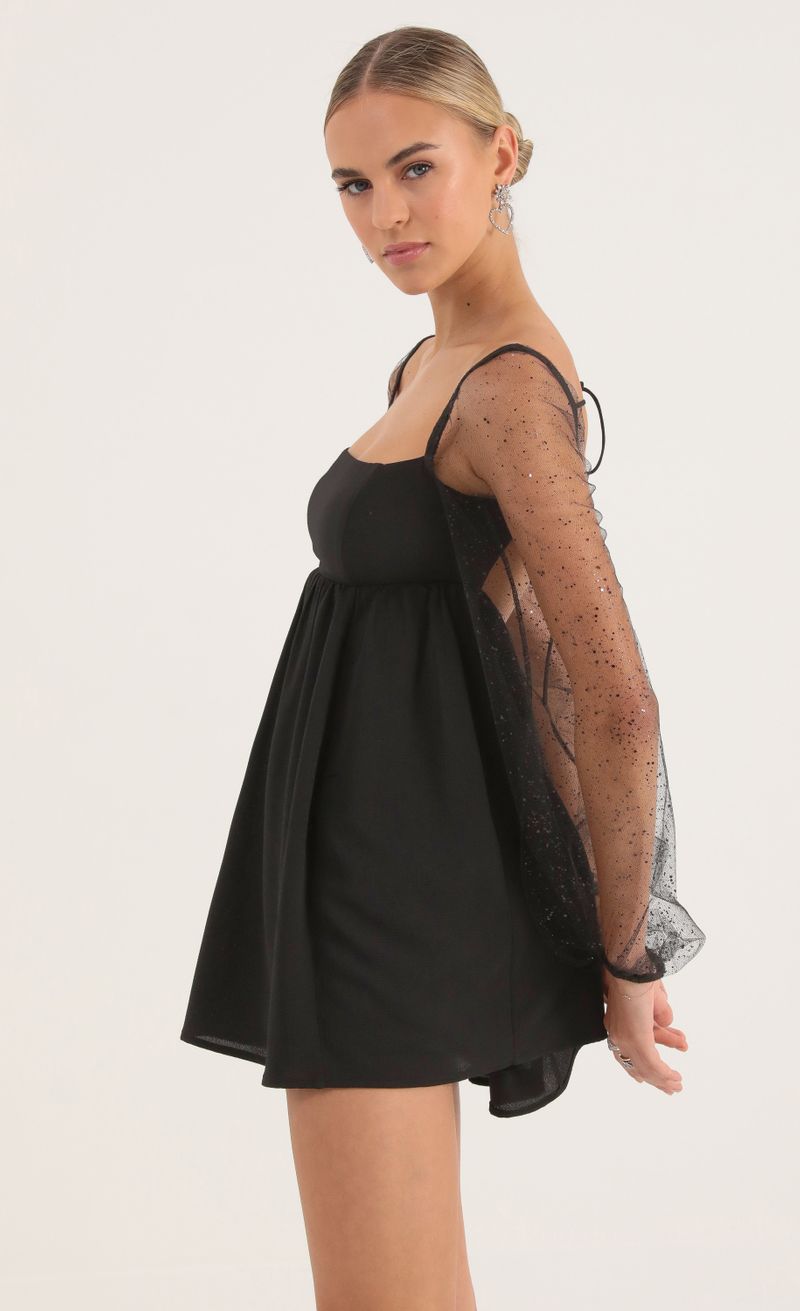 Picture Birdie Glitter Long Sleeve Baby Doll Dress in Black. Source: https://media.lucyinthesky.com/data/Oct22/800xAUTO/fb3f3070-ba4b-4fa2-bdaa-45f6014bb4ae.jpg
