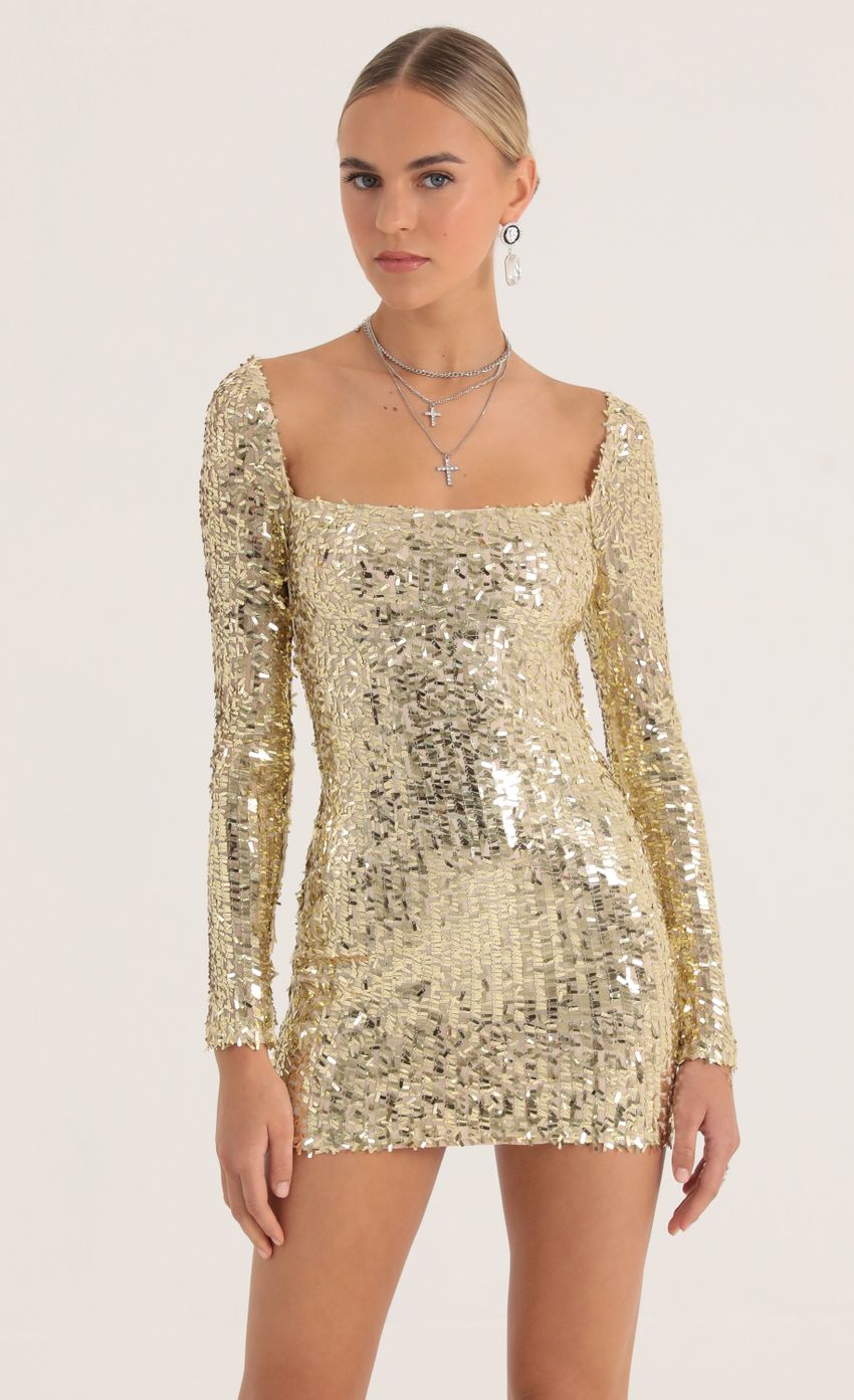 Picture Giulia Sequin Mesh Dress in Gold. Source: https://media.lucyinthesky.com/data/Oct22/850xAUTO/0d118054-647a-4284-aa5b-a1053628a5e2.jpg
