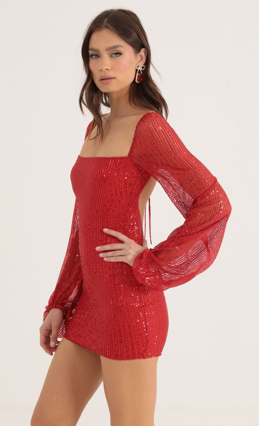 Picture Kirsten Sequin Open Back Long Sleeve Dress in Red. Source: https://media.lucyinthesky.com/data/Oct22/850xAUTO/108b839f-1356-4c01-ac57-7e5edf22a77a.jpg