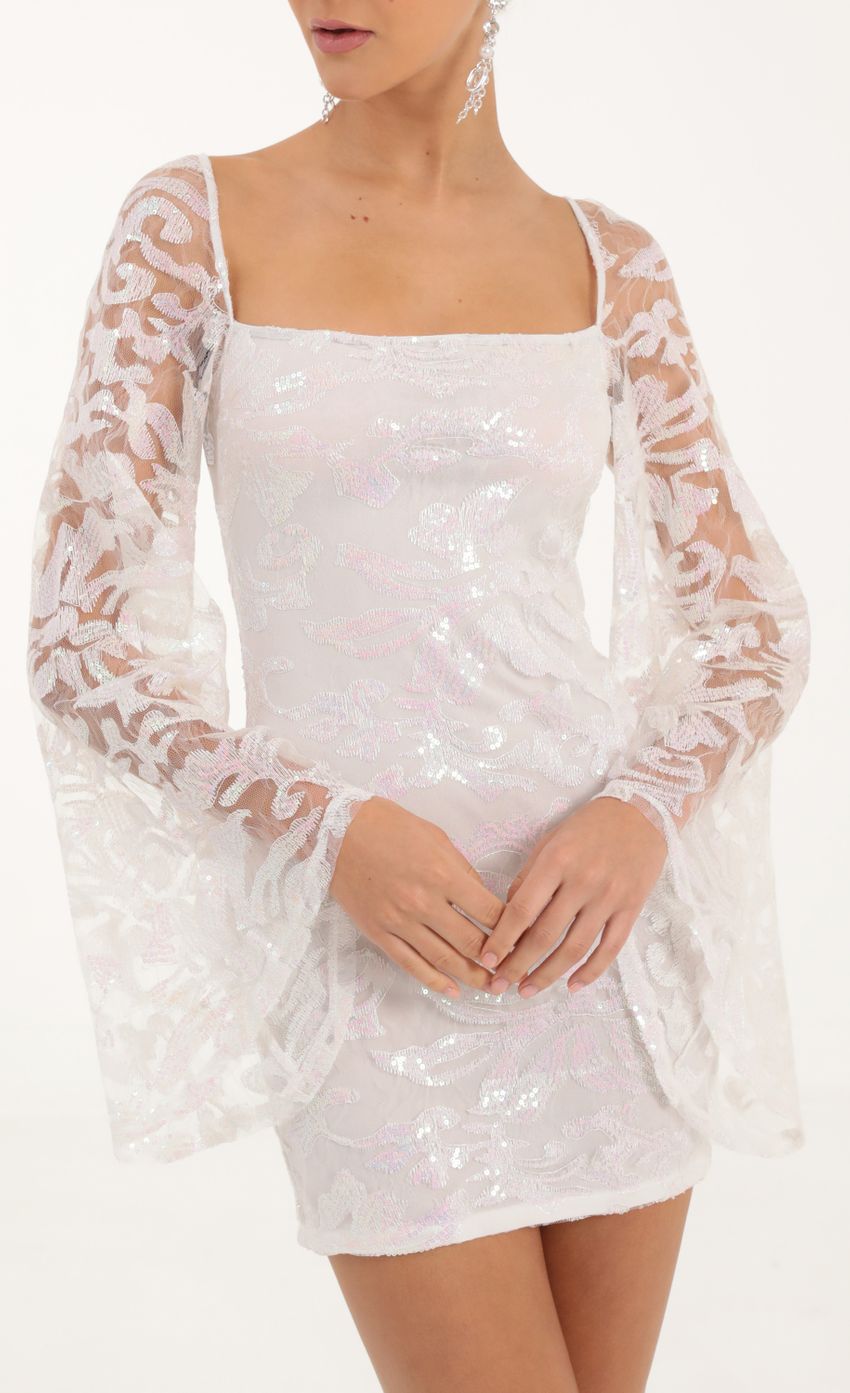Picture Elly Tulle Iridescent Sequin Flare Sleeve Dress in White. Source: https://media.lucyinthesky.com/data/Oct22/850xAUTO/1340c5d0-6994-4543-ae4d-c4ff9d6ff8c9.jpg