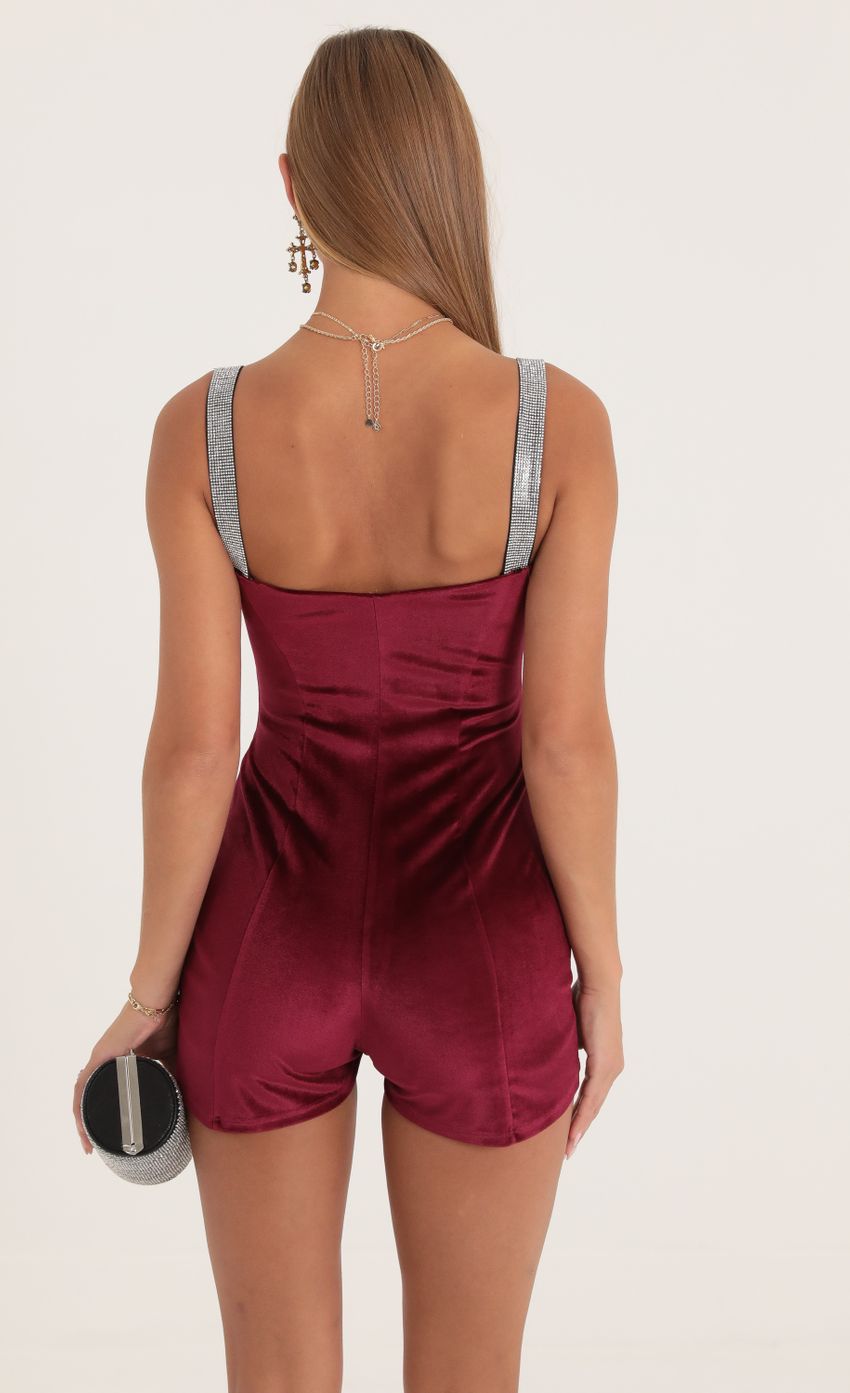 Picture Rada Velvet Hook and Eye Romper in Red. Source: https://media.lucyinthesky.com/data/Oct22/850xAUTO/6552ae35-991b-4fdd-a16a-327def32c58a.jpg