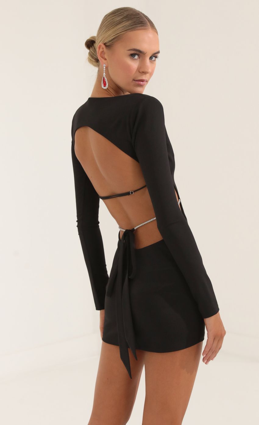 Picture Beatrix Crepe Shoulder Pad Cutout Dress in Black. Source: https://media.lucyinthesky.com/data/Oct22/850xAUTO/6c057de2-7da5-424b-8ed2-eebb0b59607d.jpg
