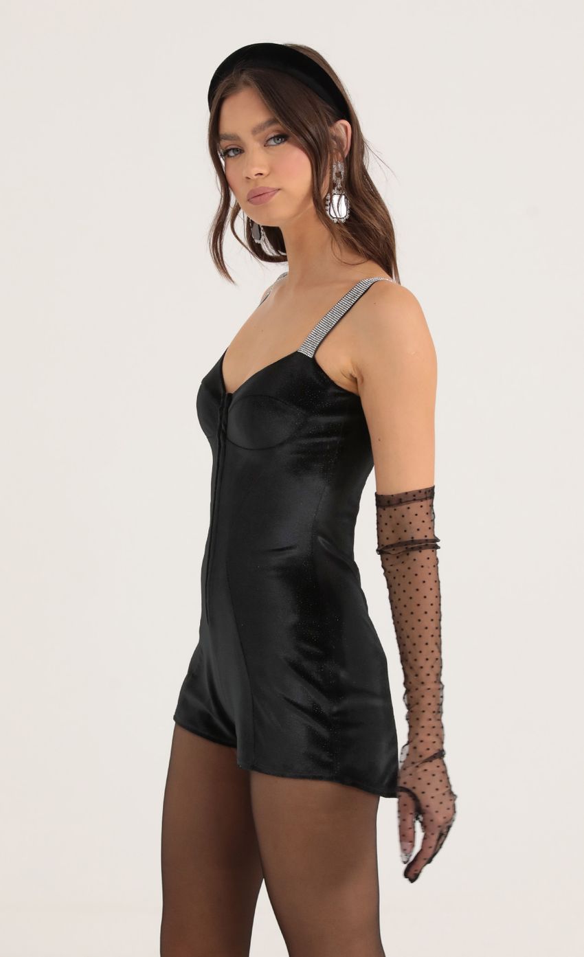 Picture Rada Velvet Shimmer Hook and Eye Romper in Black. Source: https://media.lucyinthesky.com/data/Oct22/850xAUTO/7841a7de-c3c7-4860-8b79-10f303c41303.jpg